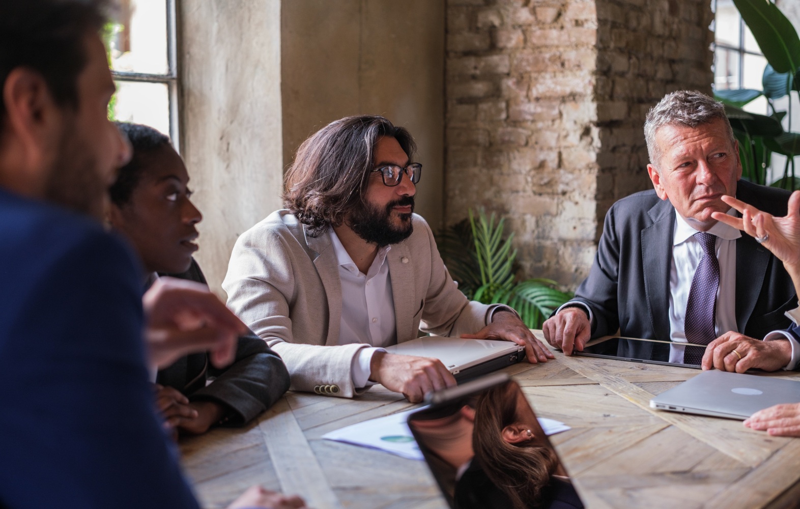 Group of diverse business people meeting and sharing ideas